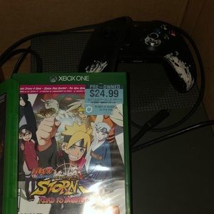 Xbox one s with the controller and two Naruto game